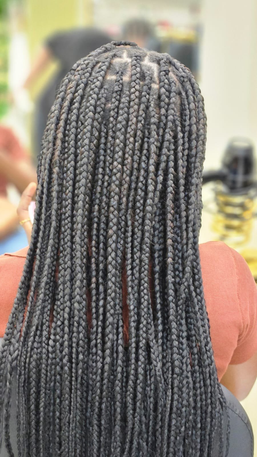 Finished braids with neat square sections, back view, at Beloved Beauty Salon in International City, Dubai