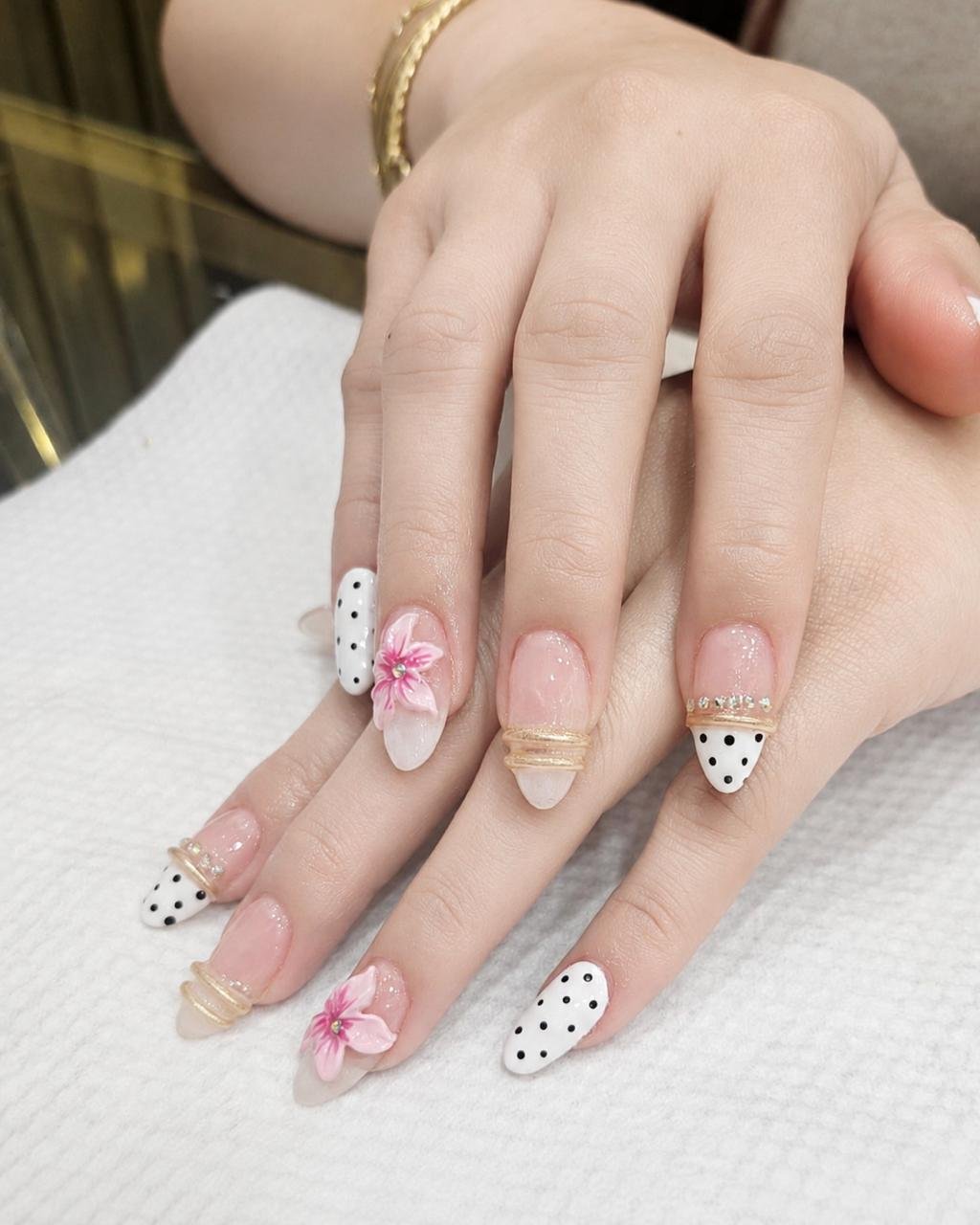 Floral and polka dot nail art result at Beloved Beauty Salon Dubai